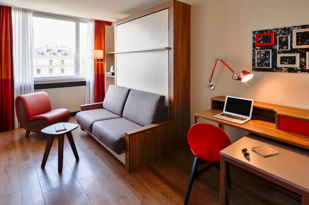 TV a/nebo společenská místnost v ubytování Aparthotel Adagio Genève Mont-Blanc