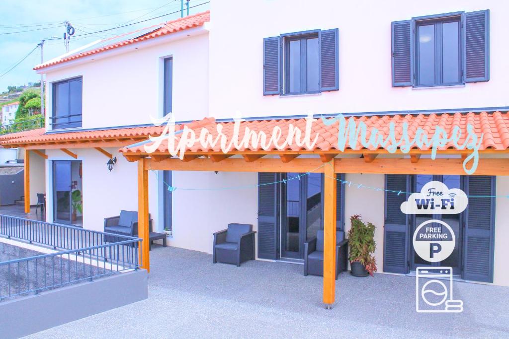 a building with a sign in front of it at House of Massapez | Calheta in Fajã da Ovelha