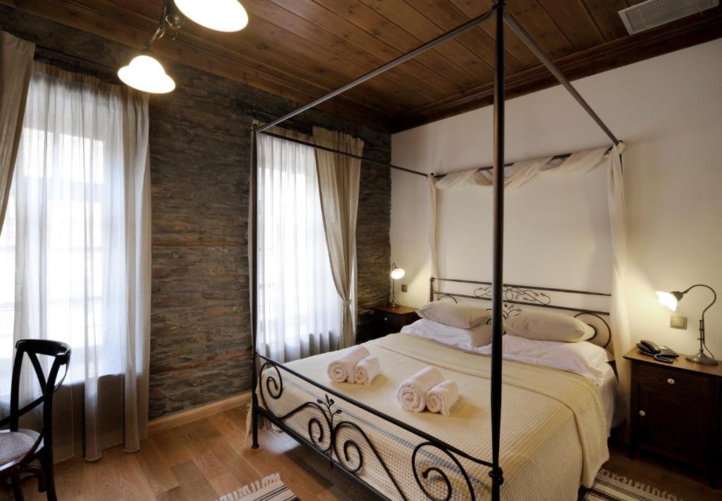 Postel nebo postele na pokoji v ubytování Marelia Hotel
