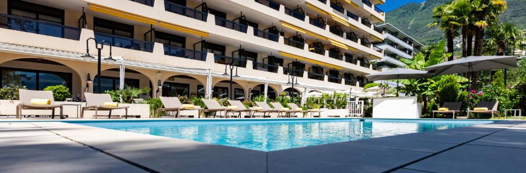 Bazén v ubytování H4 Hotel Arcadia Locarno nebo v jeho okolí