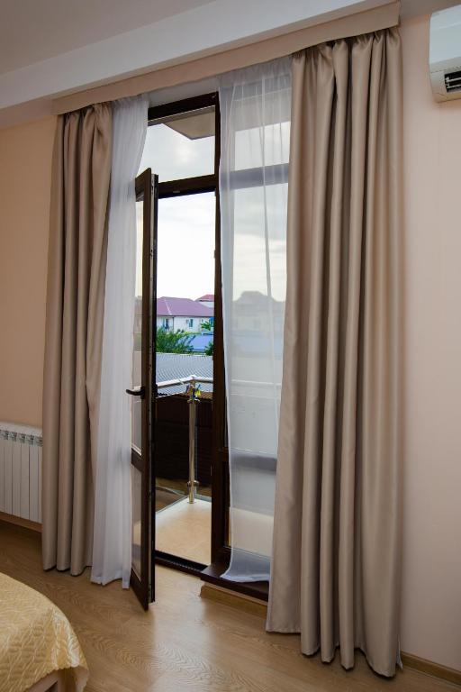 Postel nebo postele na pokoji v ubytování Hotel Sofia