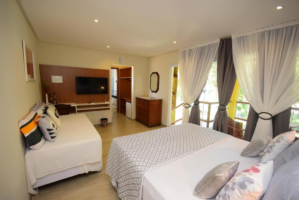 Postel nebo postele na pokoji v ubytování Quintas do Arraial Guest House
