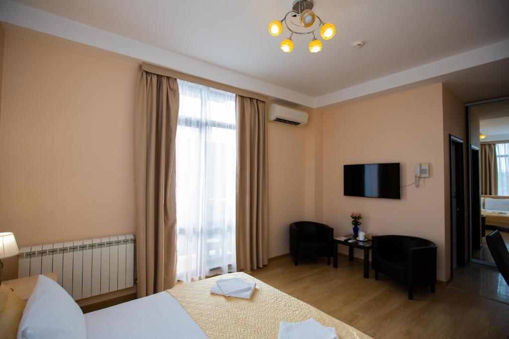 Postel nebo postele na pokoji v ubytování Hotel Sofia