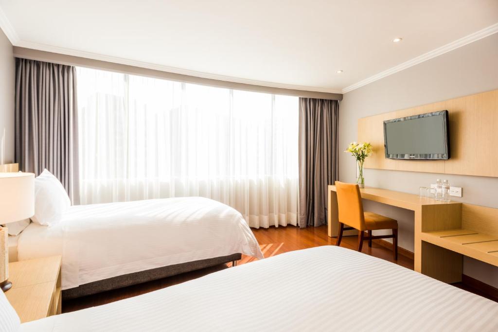 Postel nebo postele na pokoji v ubytování Cosmos 100 Hotel & Centro de Convenciones - Hoteles Cosmos