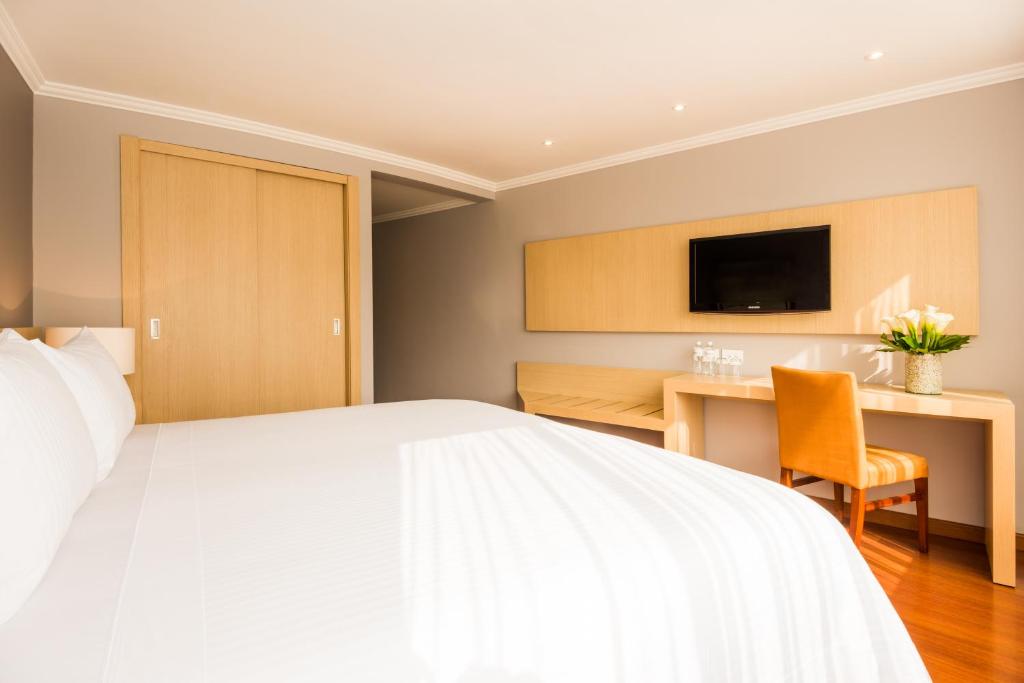 Postel nebo postele na pokoji v ubytování Cosmos 100 Hotel & Centro de Convenciones - Hoteles Cosmos
