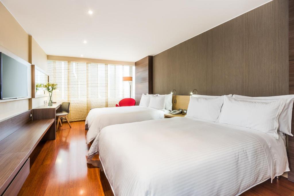 Postel nebo postele na pokoji v ubytování Cosmos 100 Hotel & Centro de Convenciones - Hoteles Cosmos