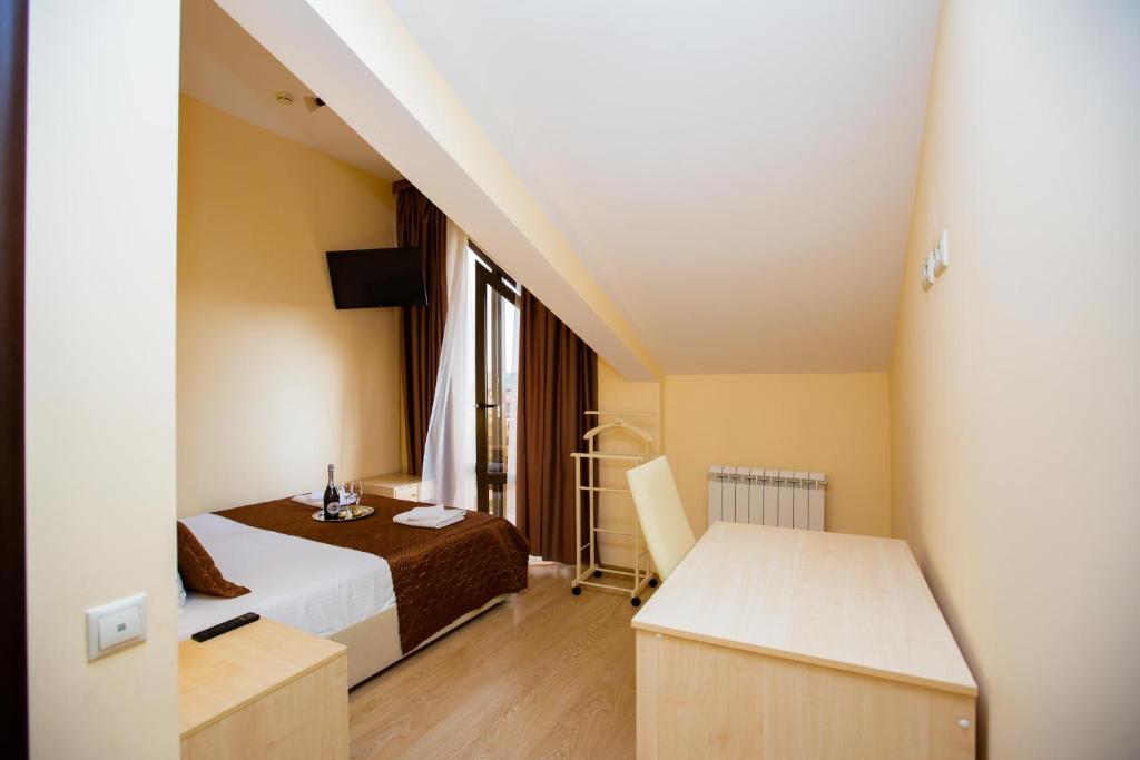 Postel nebo postele na pokoji v ubytování Hotel Sofia