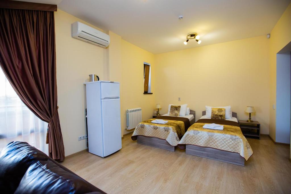 Postel nebo postele na pokoji v ubytování Hotel Sofia