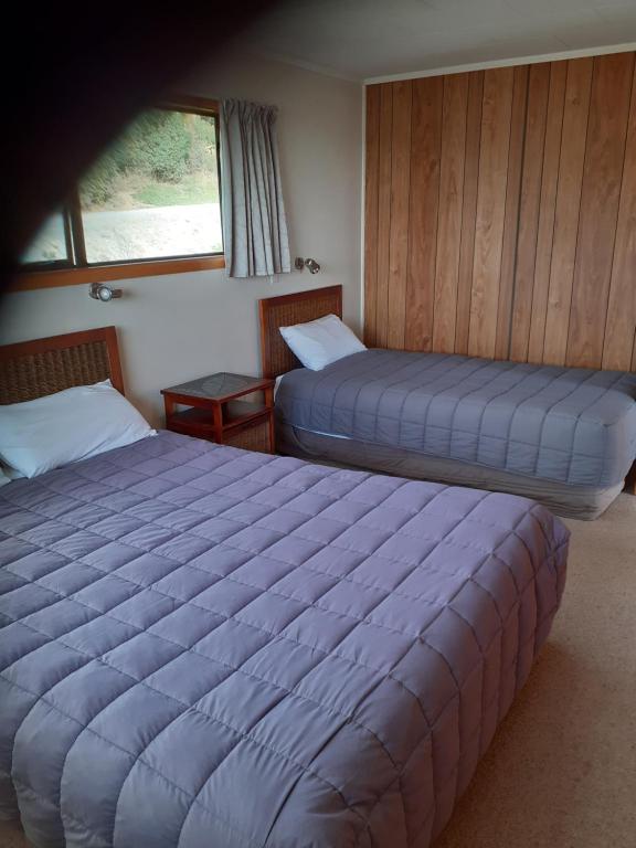 Postel nebo postele na pokoji v ubytování Moeraki Beach Motels