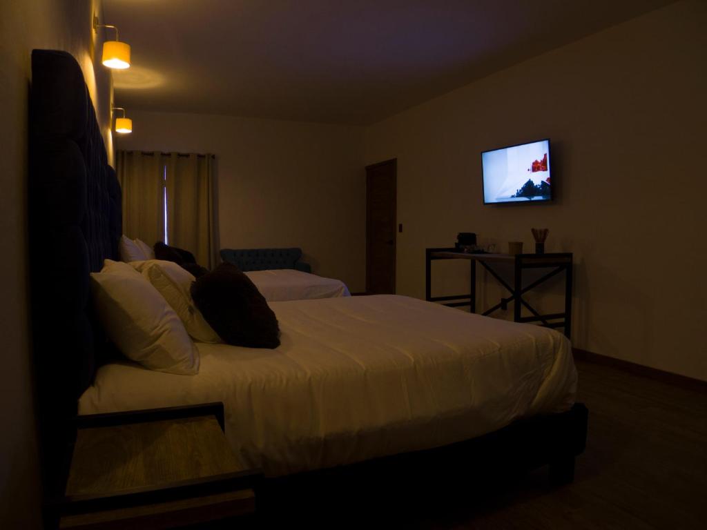 Postel nebo postele na pokoji v ubytování Hotel Santiurde SOLO ADULTOS