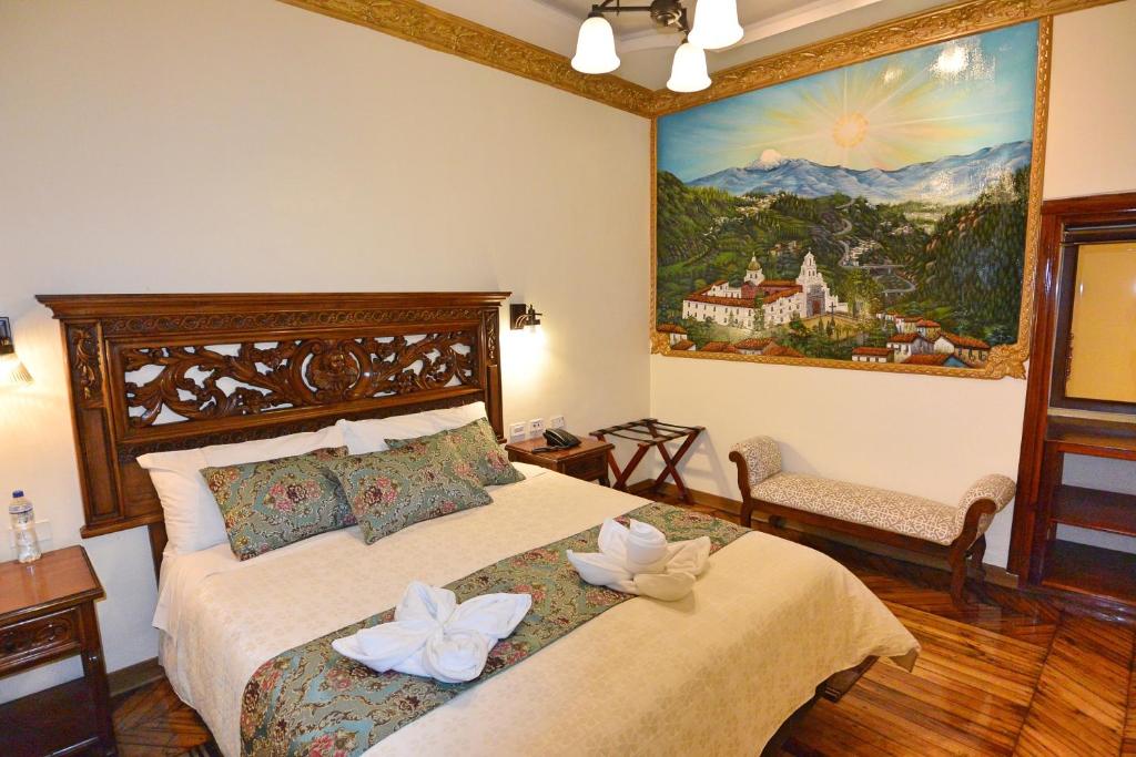 Postel nebo postele na pokoji v ubytování Hotel La Basílica Quito