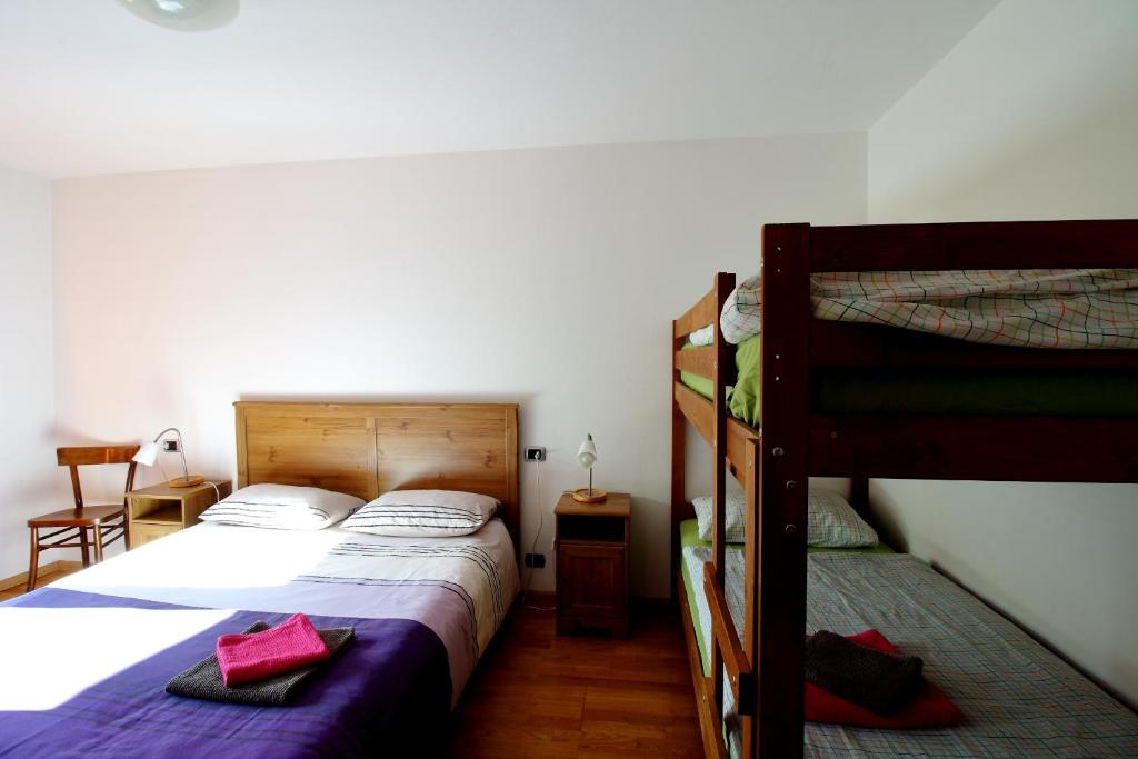 Postel nebo postele na pokoji v ubytování Nonostantetutto B&B