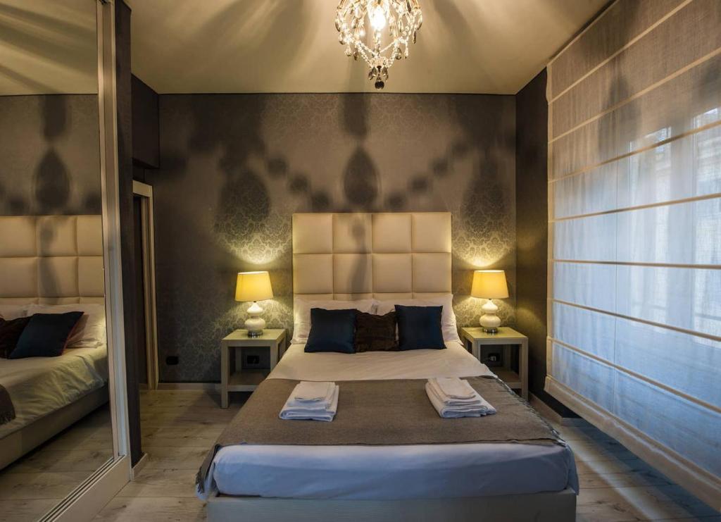 A bed or beds in a room at Vatican Color House