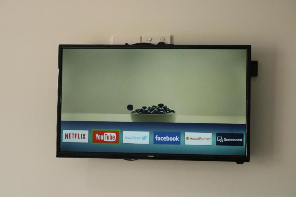 TV a/nebo společenská místnost v ubytování The Sands Motel Adelaide