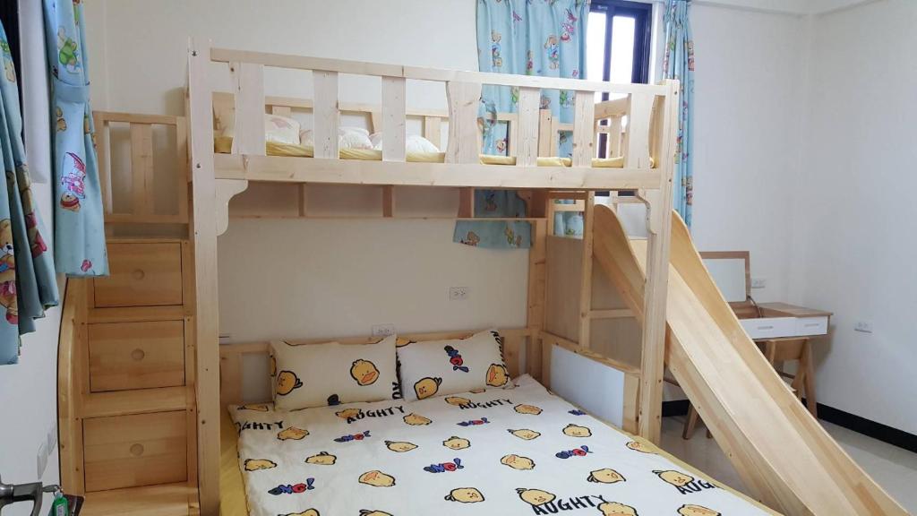Postel nebo postele na pokoji v ubytování Kinmen Huquian 58
