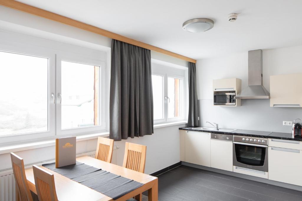 Kuchyň nebo kuchyňský kout v ubytování Sunshine Appartements Schilchegger