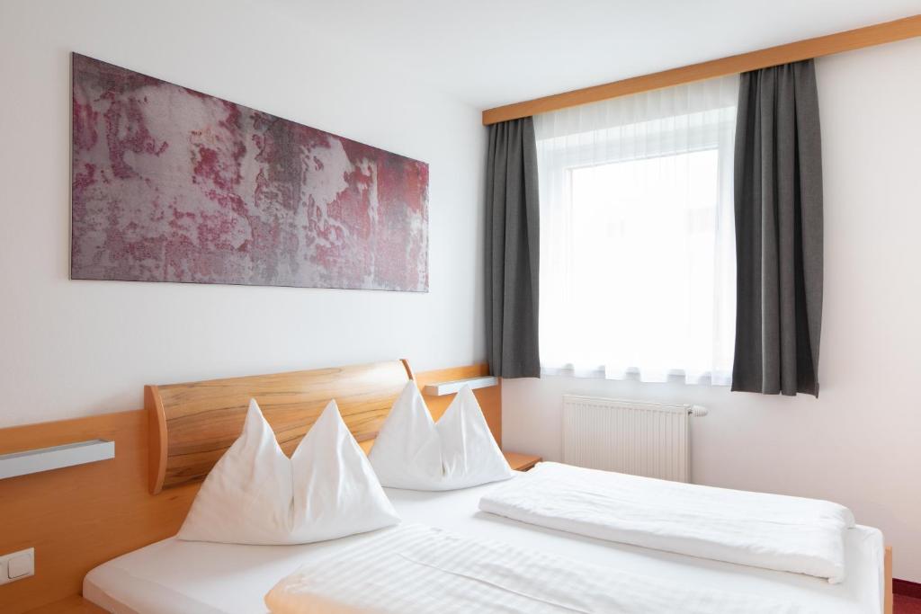 Postel nebo postele na pokoji v ubytování Sunshine Appartements Schilchegger