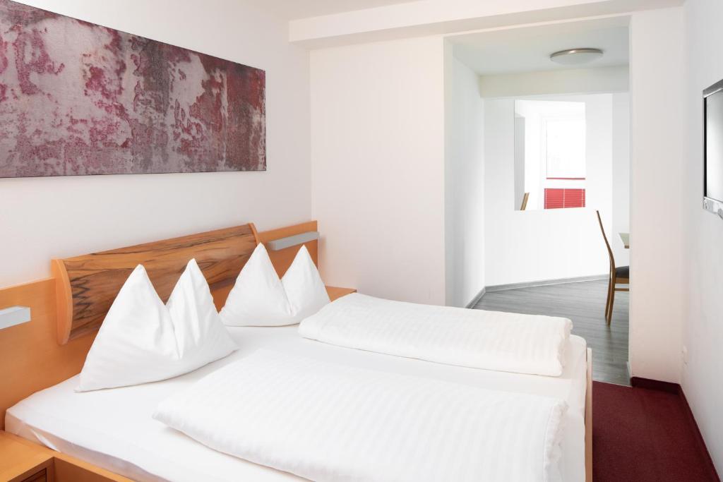 Postel nebo postele na pokoji v ubytování Sunshine Appartements Schilchegger