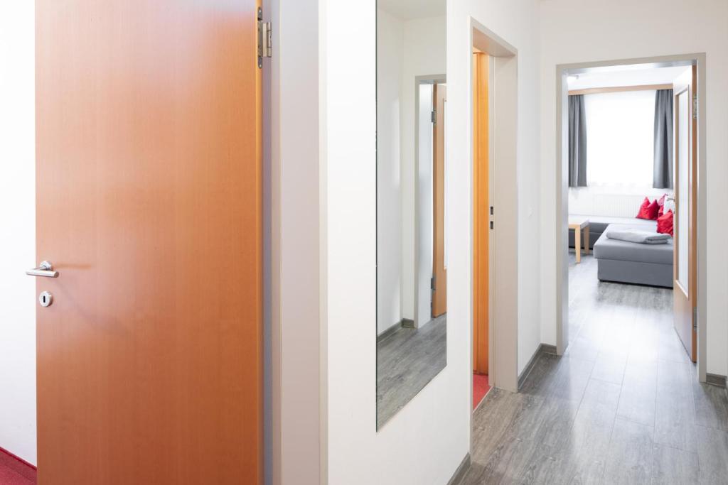 Postel nebo postele na pokoji v ubytování Sunshine Appartements Schilchegger