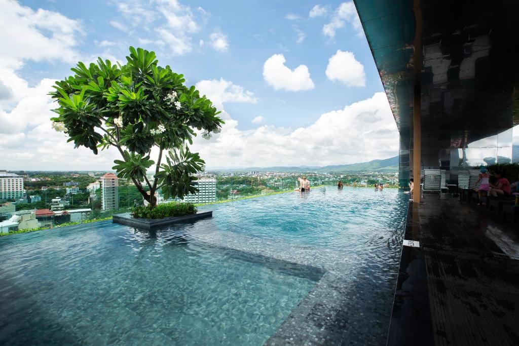 a swimming pool on the top of a building at Anta Residence ''Self-sevice apartment'' in Chiang Mai