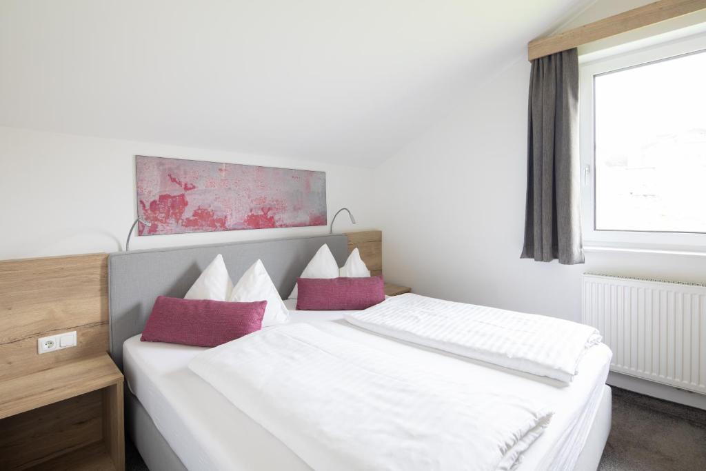 Postel nebo postele na pokoji v ubytování Sunshine Appartements Schilchegger