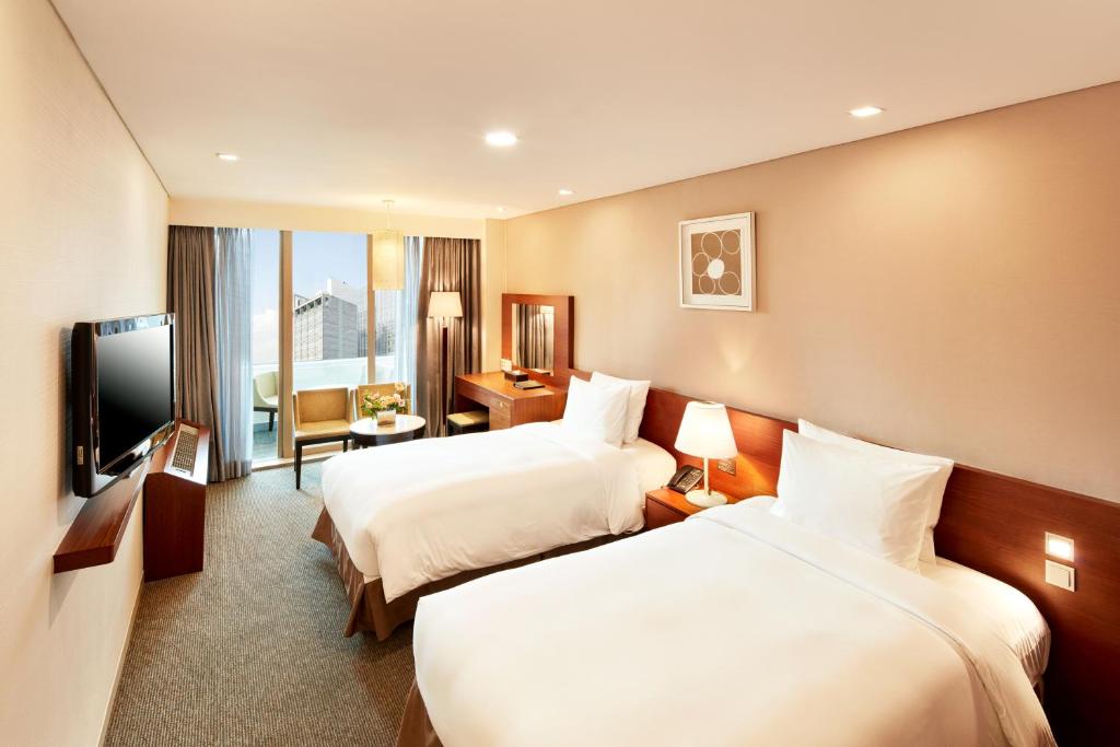 Cama ou camas em um quarto em Hotel PJ Myeongdong