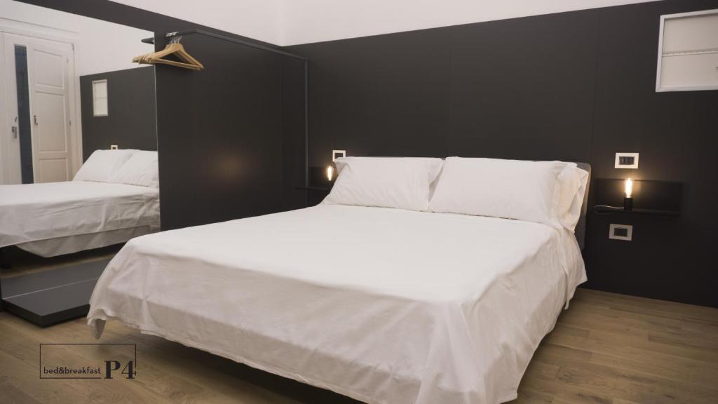 Postel nebo postele na pokoji v ubytování P4 Ortigia_Siracusa