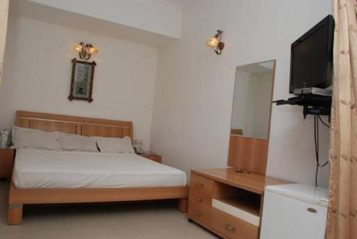 Postel nebo postele na pokoji v ubytování Solo Victoria Hotel