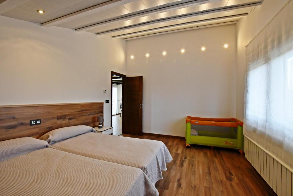 A bed or beds in a room at Casa Rural Atalaya House