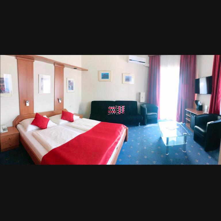 Postel nebo postele na pokoji v ubytování Hotel Aragia