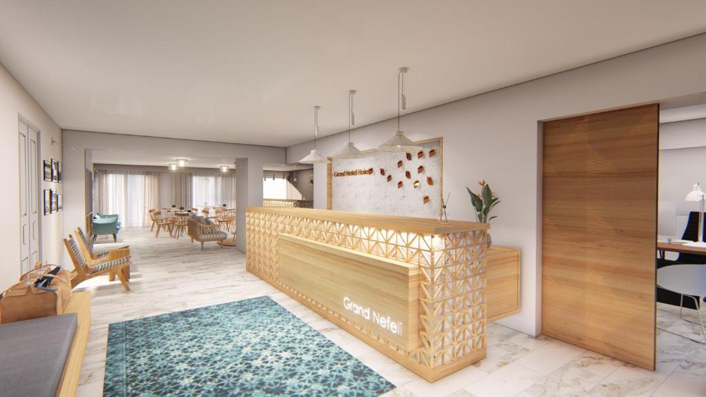 a living room with a fireplace and a dining room at Hotel Grand Nefeli in Vasiliki