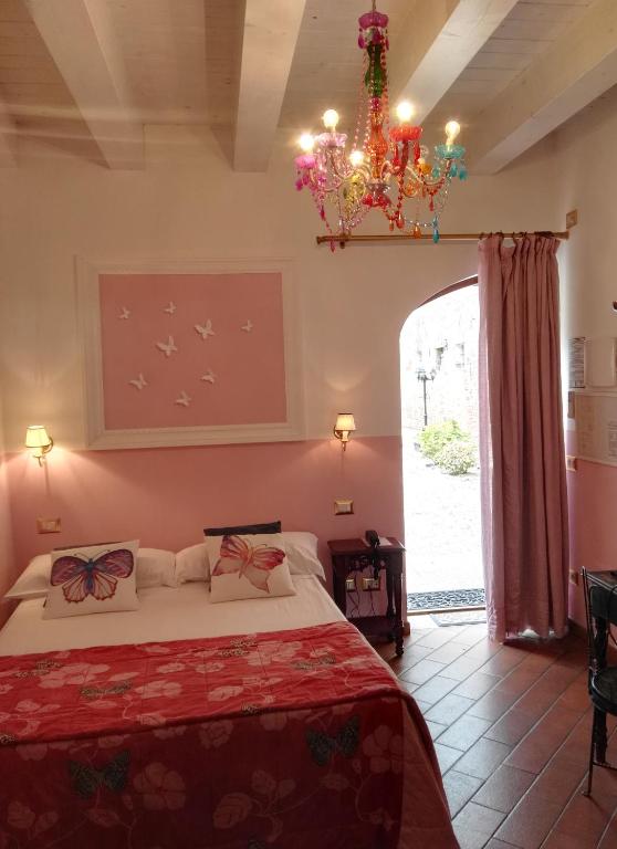 Postel nebo postele na pokoji v ubytování Relais Alcova del Doge
