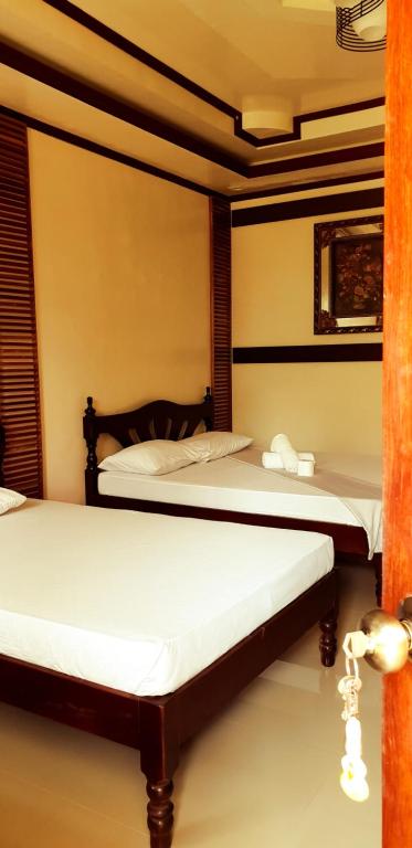 Postel nebo postele na pokoji v ubytování Westpoint Inn