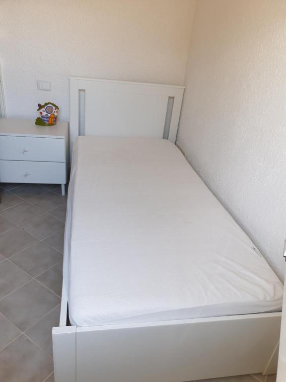 A bed or beds in a room at LA VILLA fronte SPIAGGIA BANDIERA BLU