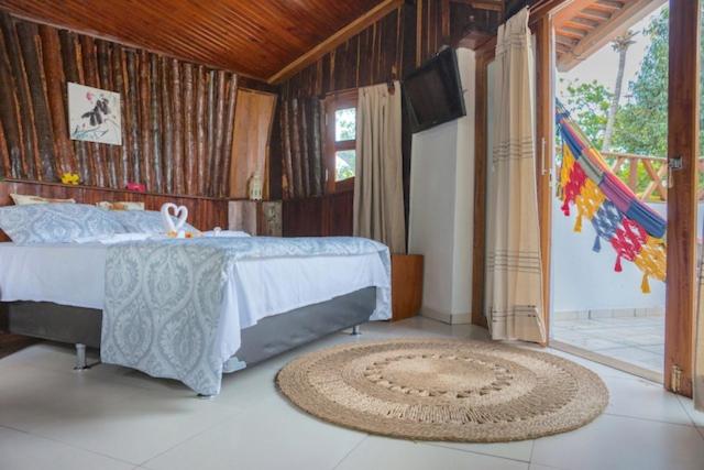Cama ou camas em um quarto em Pousada Villa Caju