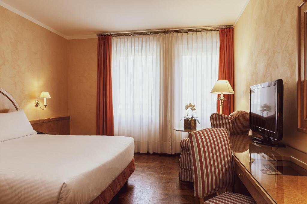 TV a/nebo společenská místnost v ubytování Agora' Palace Hotel