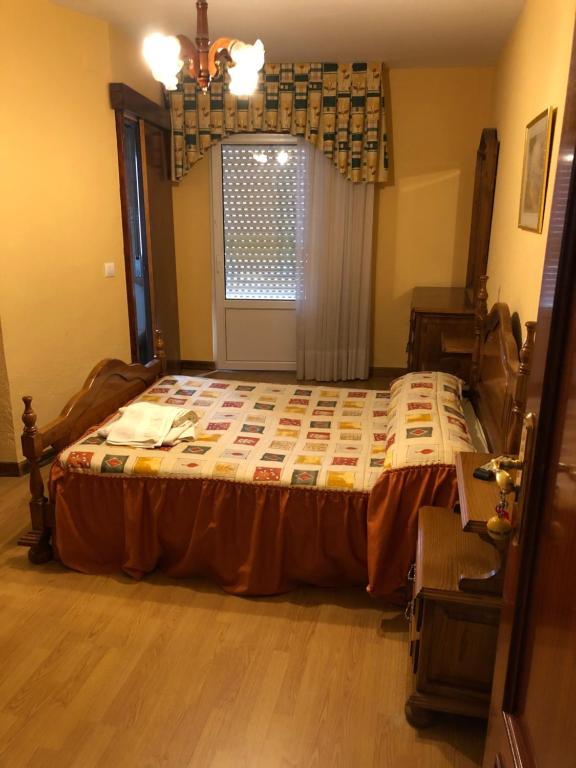 Postel nebo postele na pokoji v ubytování HOSTAL EL ESCUDO