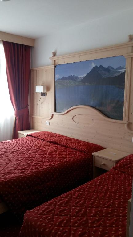 Postel nebo postele na pokoji v ubytování Albergo Garni Martina