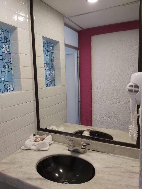 Koupelna v ubytování Hotel Aurora