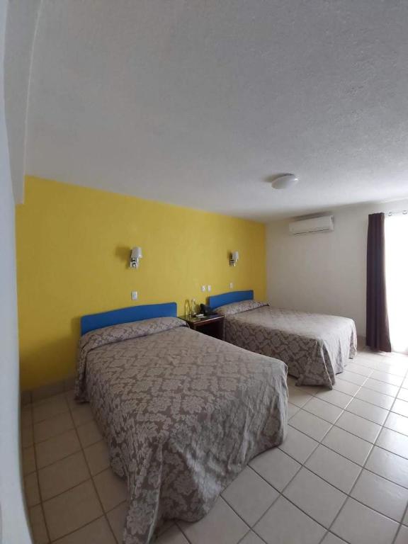 Postel nebo postele na pokoji v ubytování Hotel Aurora