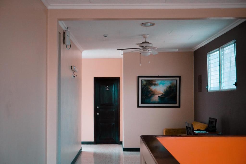 Postel nebo postele na pokoji v ubytování Urdesa Suites Hotel