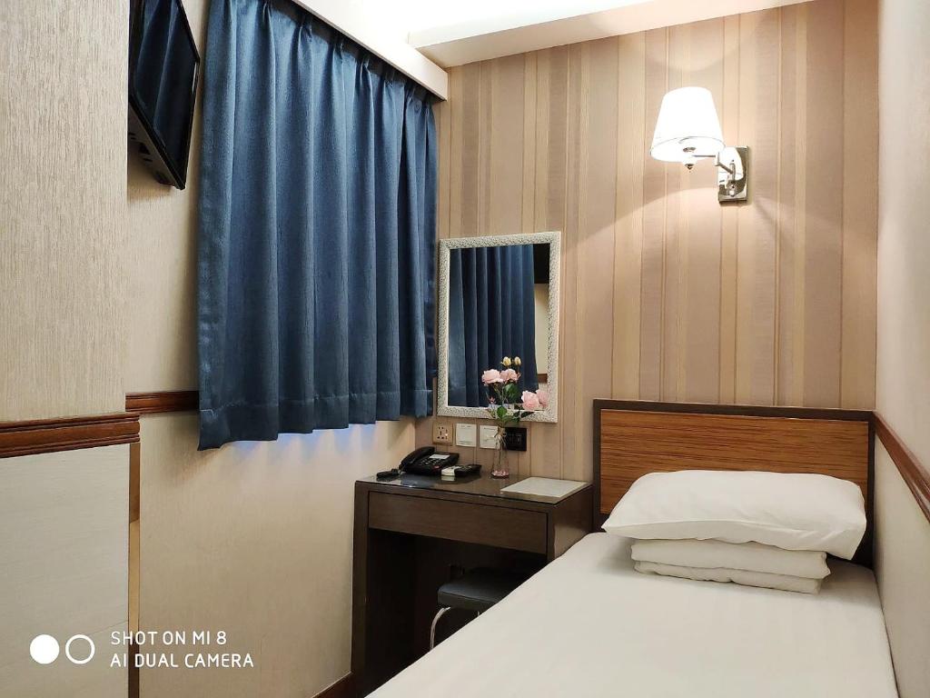Postel nebo postele na pokoji v ubytování Celltronik Hostel 先創旅店
