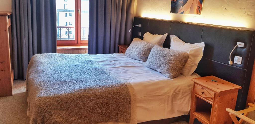 Postel nebo postele na pokoji v ubytování Park Hotel Suisse & Spa