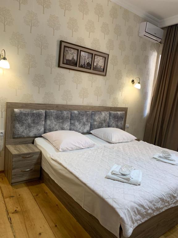 Postel nebo postele na pokoji v ubytování Guest House Rafael