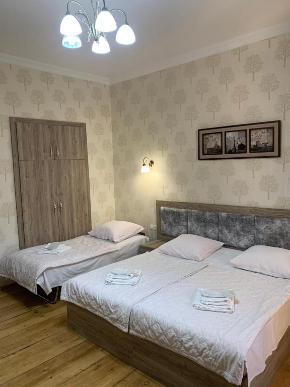 Postel nebo postele na pokoji v ubytování Guest House Rafael
