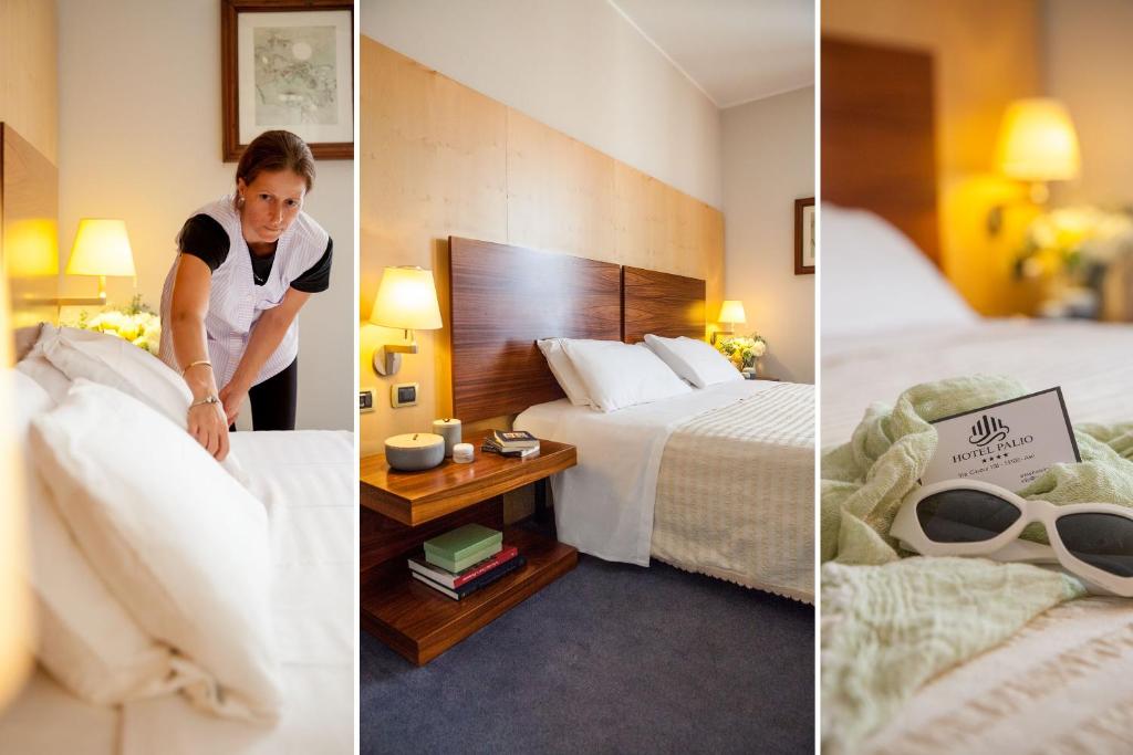 una mujer haciendo una cama en una habitación de hotel en Hotel Palio, en Asti