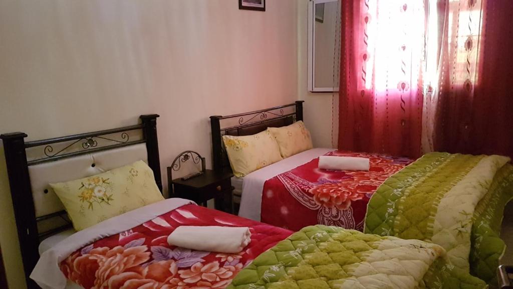 Postel nebo postele na pokoji v ubytování Hotel Nice 06
