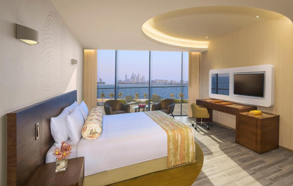 Postel nebo postele na pokoji v ubytování The Retreat Palm Dubai MGallery by Sofitel