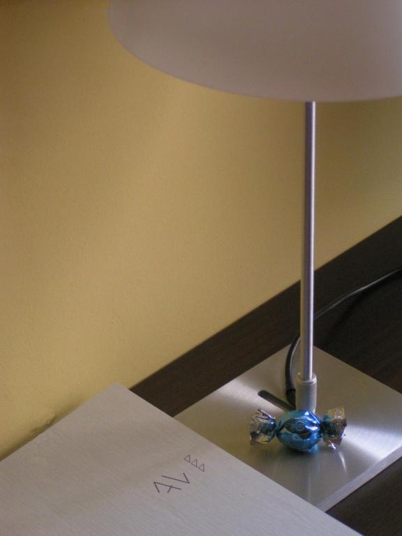 Uma cama ou camas num quarto em Albergo Verdi