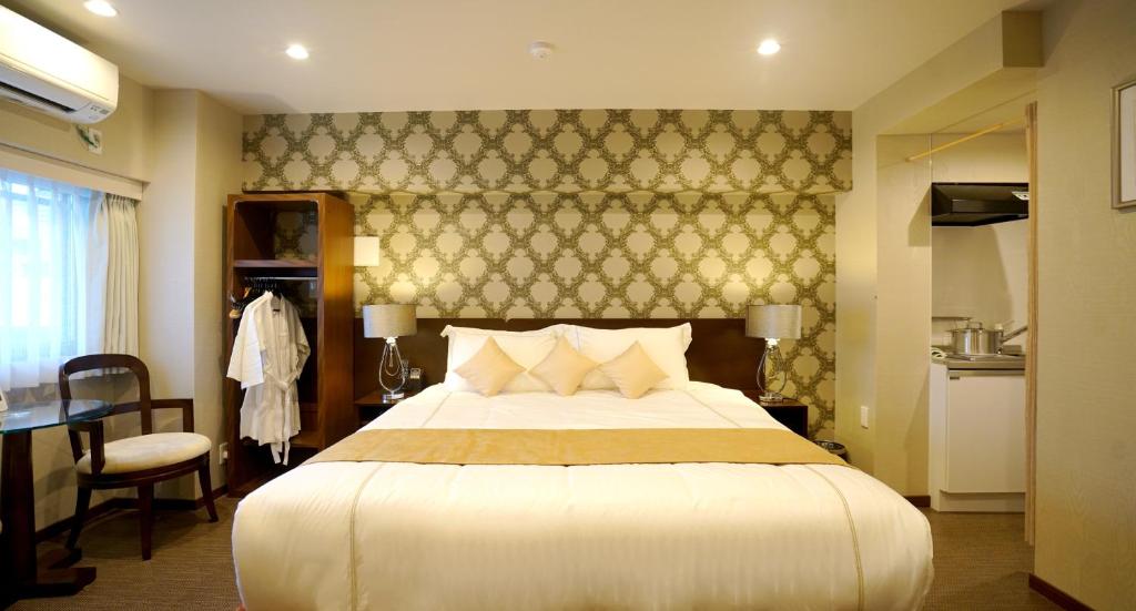 เตียงในห้องที่ Le Tour Hotel Akihabara Ekimae 楽途ホテル秋葉原駅前店